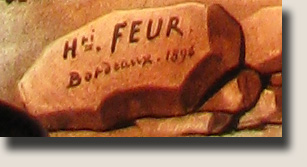 De handtekening van Henri Feur op één van de glasramen in de kerk van Rennes-le-Château